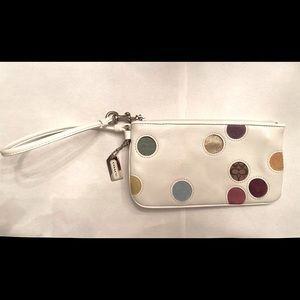 AUTHENTIC COACH leather wristlet.